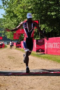 Crossing the finish line at my first Tri